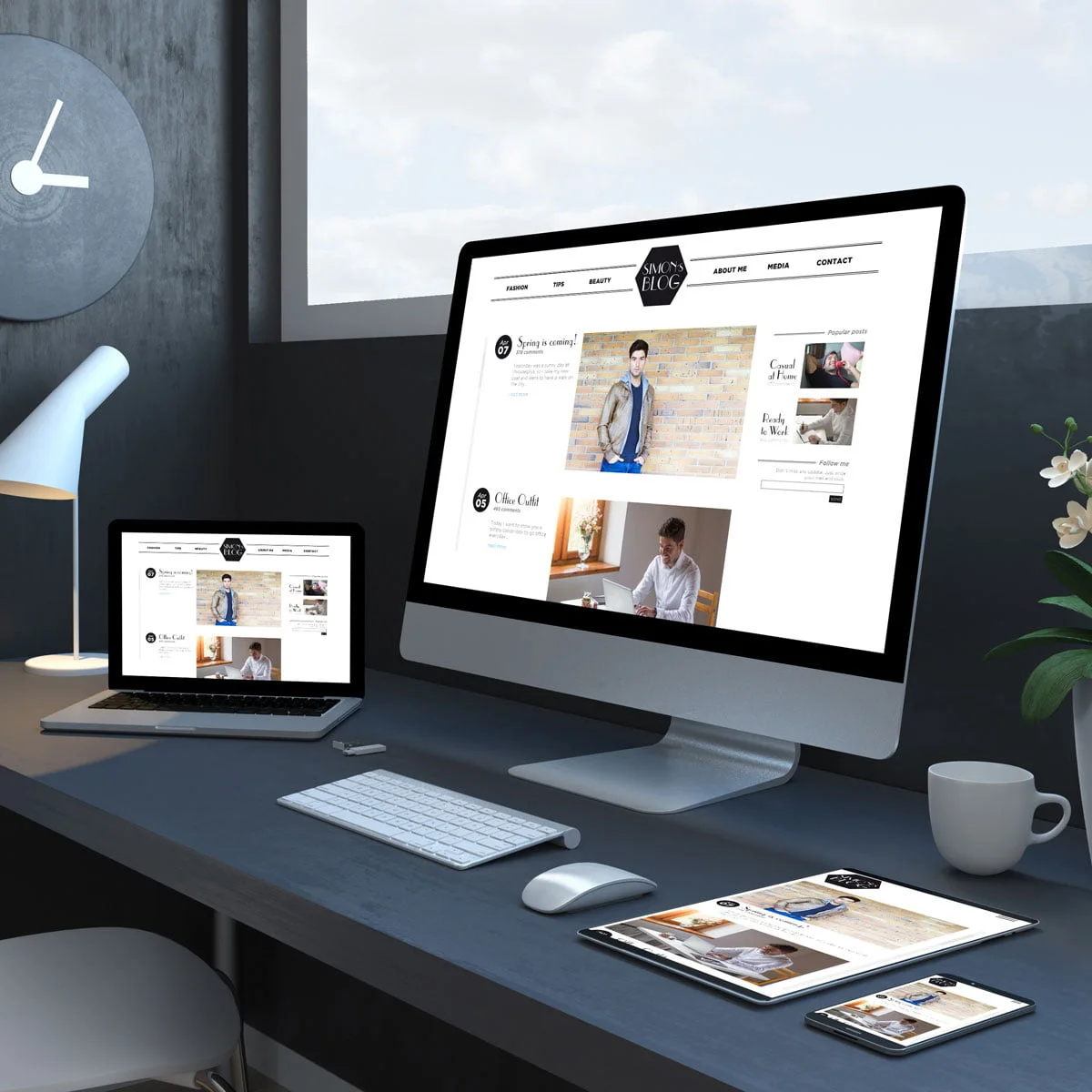 A desk with a laptop and a monitor showing a modern website. A desk with a laptop and a monitor showing a modern website.